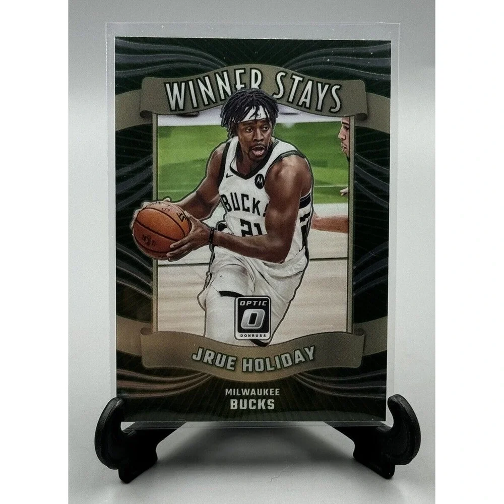 2023-24 Panini‎ Optic #9 Jrue Holiday Winner Stays Bucks